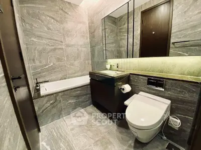 Luxurious modern bathroom with elegant stone tiles and sleek fixtures