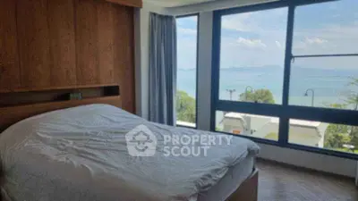 Luxurious bedroom with stunning ocean view and large windows