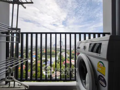 High-rise balcony with washing machine and stunning city view