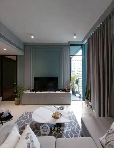 Modern living room with stylish decor and balcony view in urban apartment