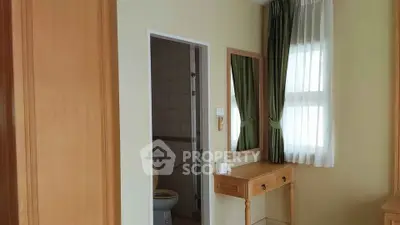 Cozy bedroom with ensuite bathroom and elegant wooden furniture
