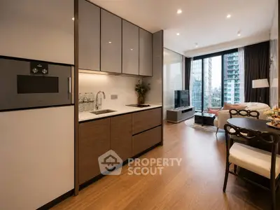 Modern open-plan kitchen and living room with city view, sleek cabinetry, and elegant decor.