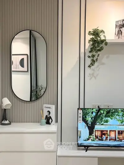 Modern living room with stylish decor and wall-mounted TV