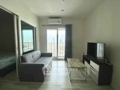 Modern living room with city view, featuring a sleek sofa, TV, and marble coffee table.