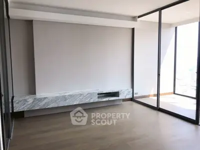 Spacious modern living room with floor-to-ceiling windows and elegant marble TV stand.