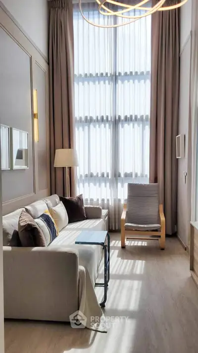 Bright and cozy living room with high ceilings and modern decor