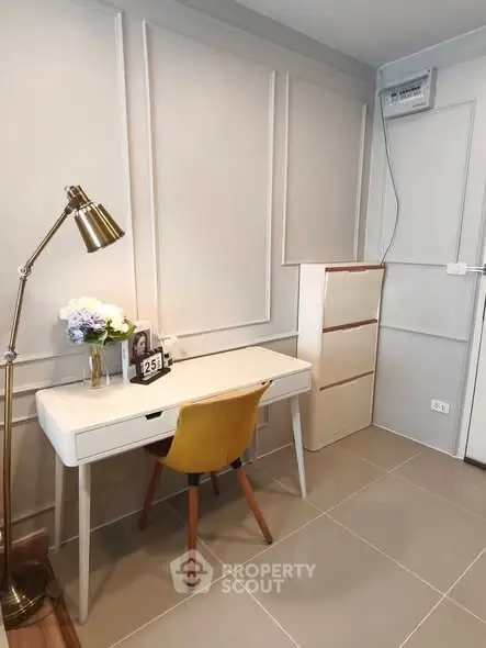 Chic study area with modern desk and stylish chair in a cozy apartment.
