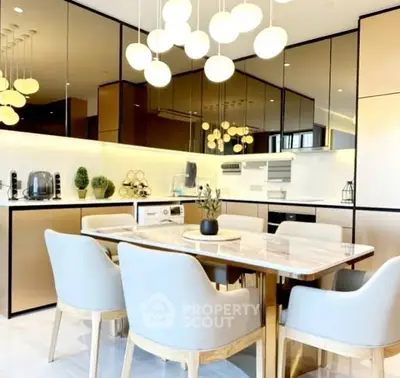 Luxurious modern kitchen with elegant dining area and stylish lighting