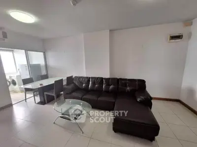 Spacious living room with modern furniture and dining area