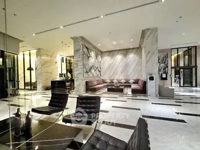 Luxurious modern lobby with marble floors and elegant seating area