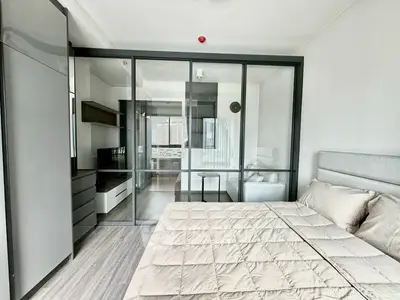 Modern bedroom with glass partition and stylish decor