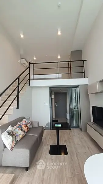 Modern loft apartment with stylish mezzanine and cozy living area