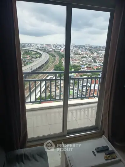 Stunning high-rise apartment with panoramic city view from the balcony, perfect for urban living.