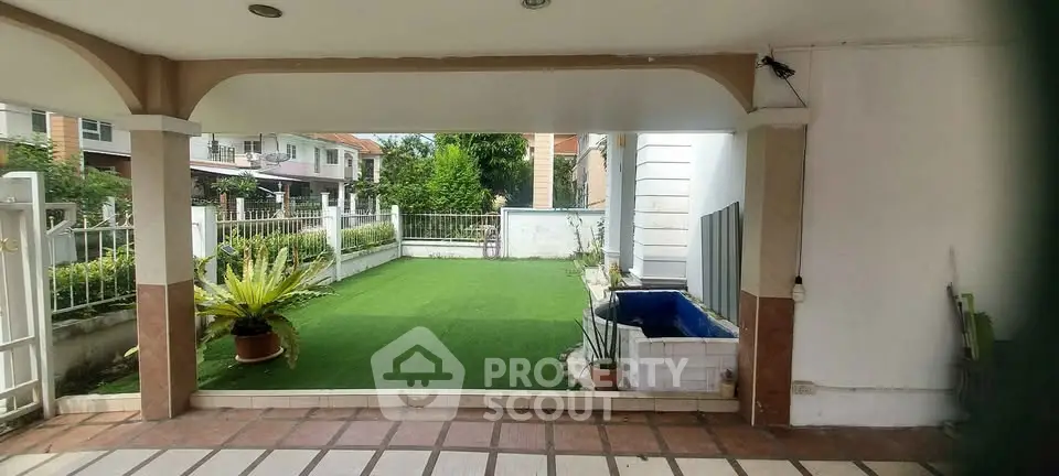 Charming garden view with lush greenery and cozy patio area, perfect for relaxation and outdoor gatherings.