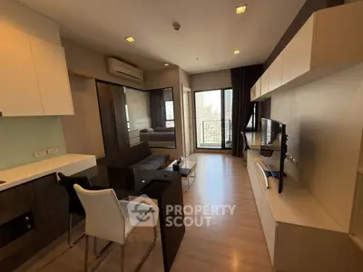 Modern living room with sleek furniture and balcony view