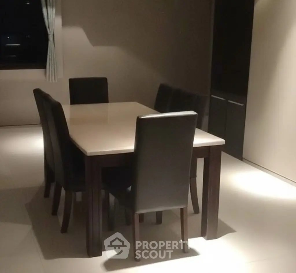 Elegant dining room with modern table and chairs, perfect for stylish gatherings.