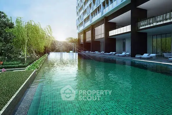 Luxurious modern apartment building with stunning pool and lush greenery
