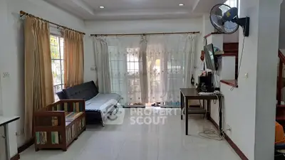 Spacious living room with natural light and modern decor