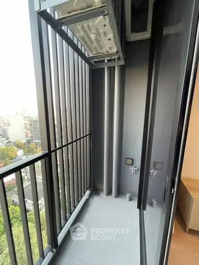 Modern balcony with city view and sleek metal railings