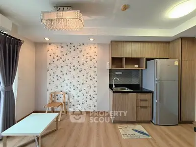 Modern studio apartment with chic kitchenette and stylish decor