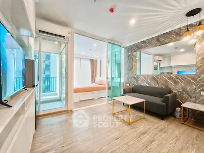 Modern open-plan living room with stylish decor and natural light