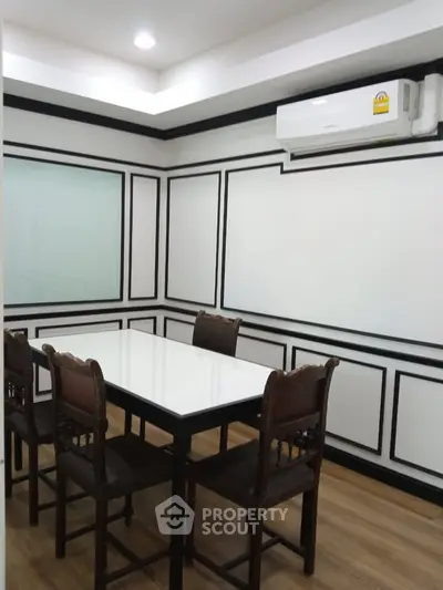 Elegant study room with classic paneling and modern air conditioning