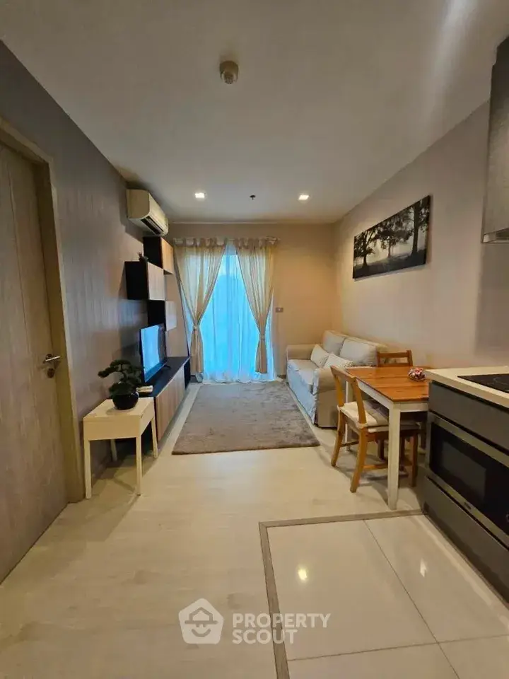 Modern living room with cozy seating and stylish decor in a contemporary apartment.