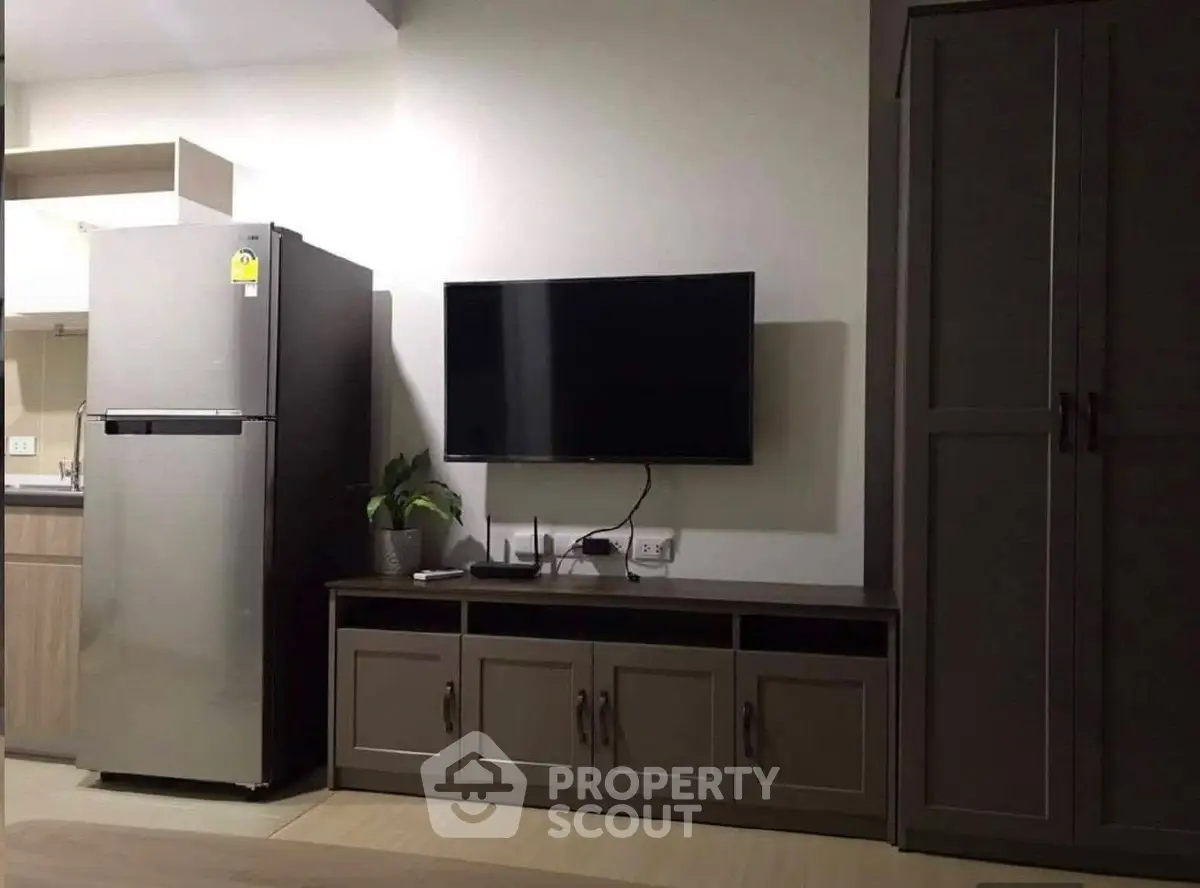 Modern living room with sleek TV setup and stylish storage cabinets