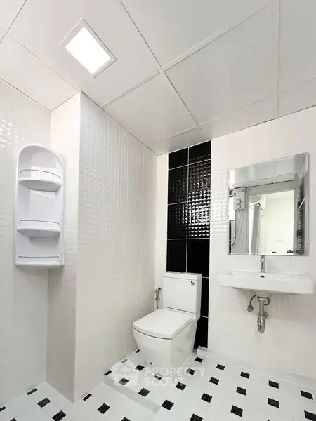 Modern bathroom with sleek design and monochrome tiles