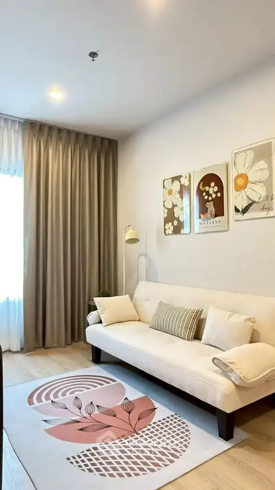 Chic living room with modern decor and cozy sofa, perfect for relaxation.
