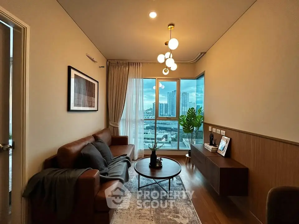 Modern living room with city view, stylish lighting, and cozy seating area.