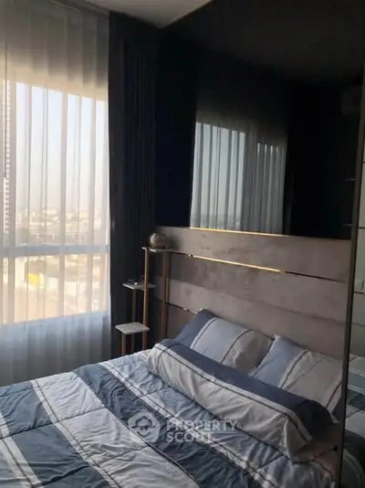 Modern bedroom with large windows and stylish decor in a high-rise apartment.