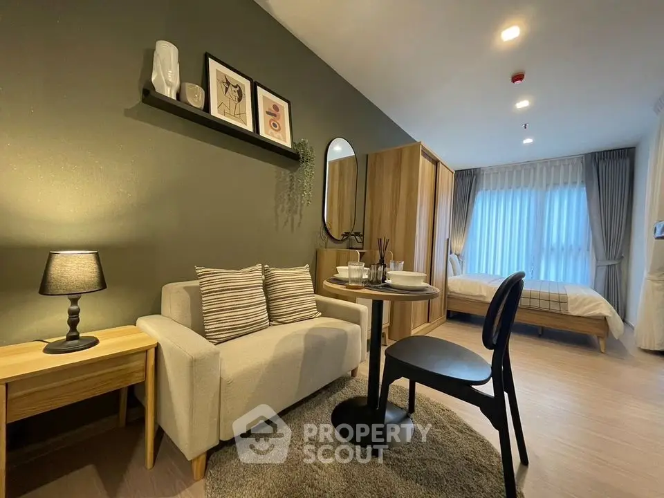 Modern studio apartment with cozy living area and stylish decor