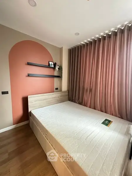 Modern bedroom with stylish decor and natural light