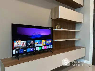 Modern living room with sleek TV unit and stylish shelving