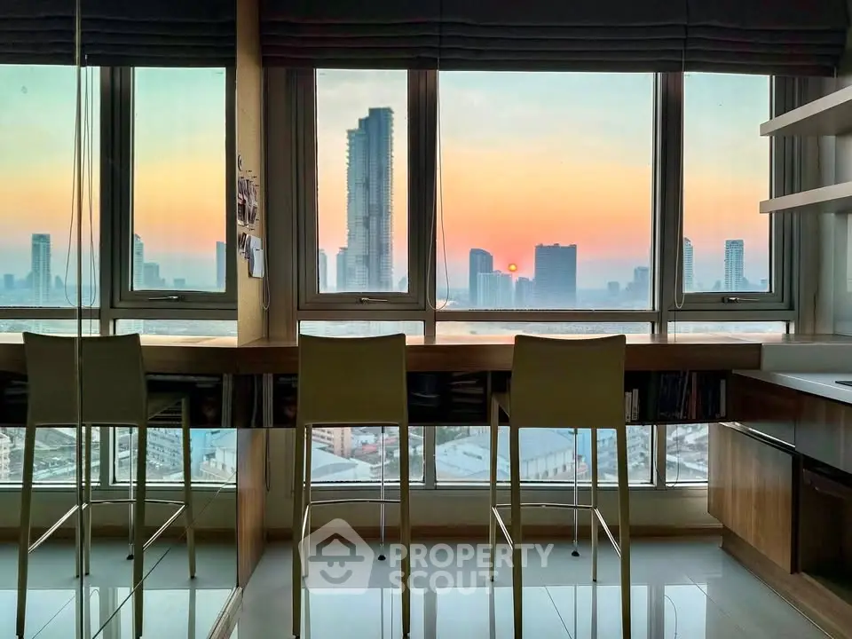 Stunning high-rise apartment with panoramic city view at sunset, featuring modern interior and sleek design.