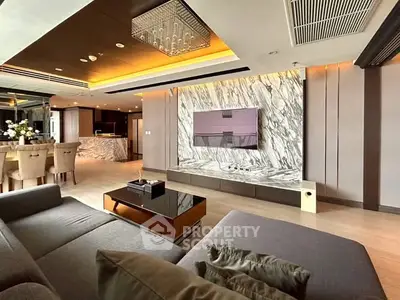 Luxurious modern living room with marble accent wall and elegant dining area