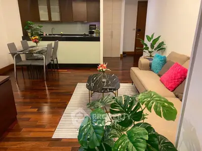 Stylish open layout living room with modern kitchen and elegant decor