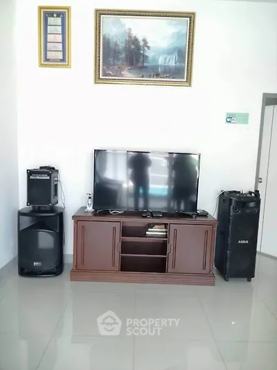Modern living room with sleek TV setup and elegant decor