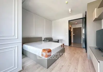 Modern bedroom with stylish decor and natural light in a contemporary apartment.