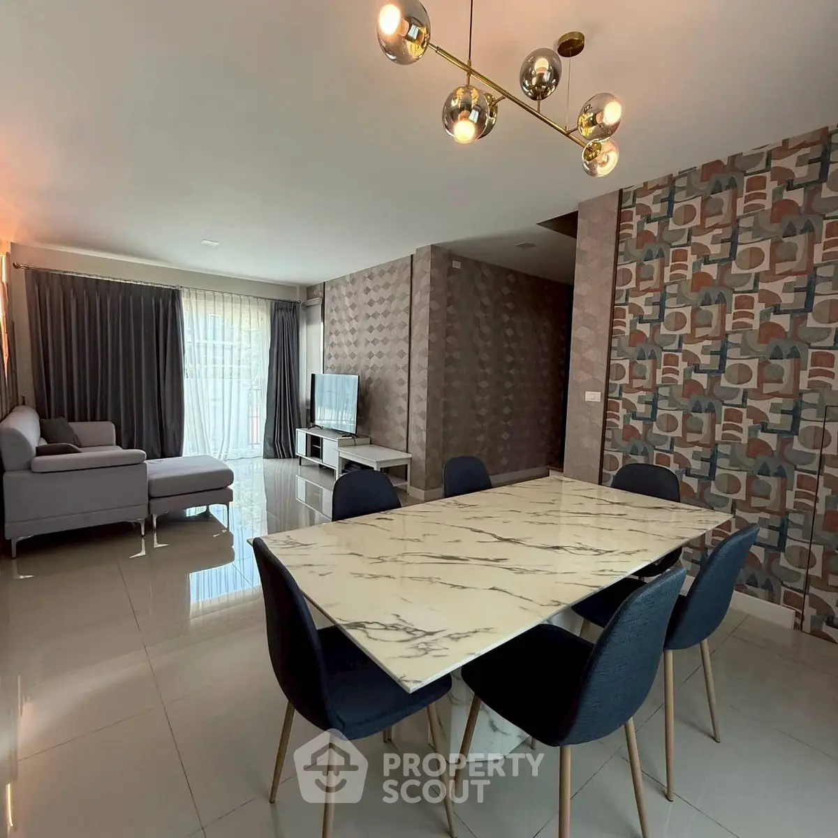 Spacious modern living room with elegant dining area and stylish decor