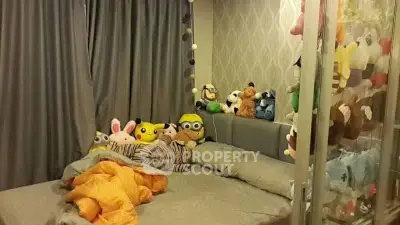 Cozy bedroom with plush toys and modern decor, perfect for a playful and inviting atmosphere.