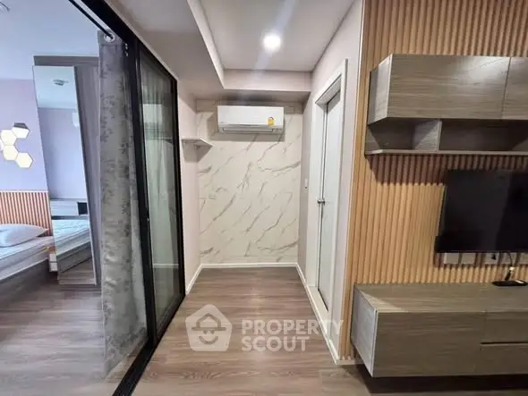 Modern apartment interior with wood accents and sliding glass door