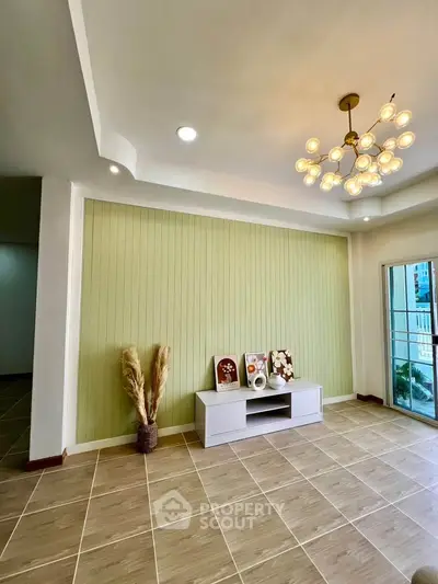 Stylish living room with modern chandelier and elegant decor