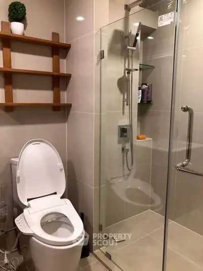 Modern bathroom with glass shower and sleek shelving