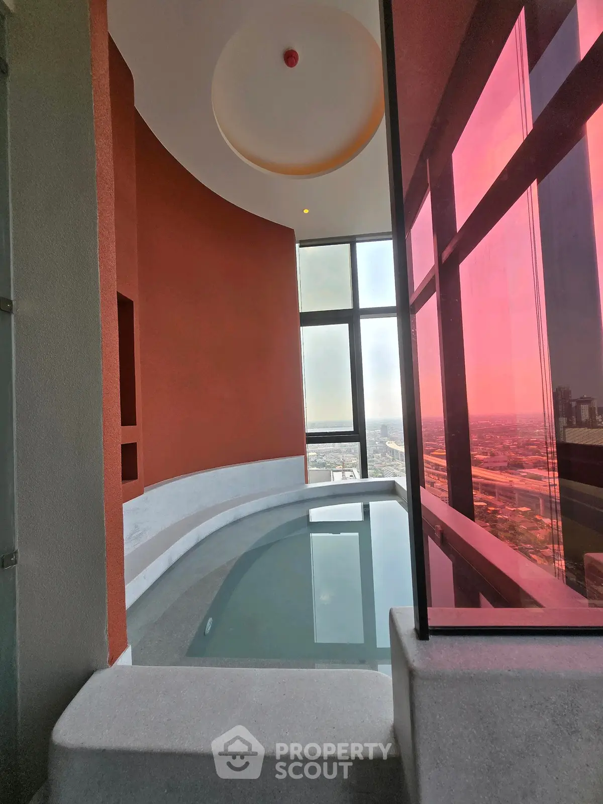 Luxurious indoor pool with panoramic city view and modern design