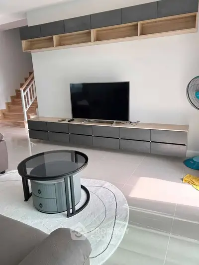 Modern living room with sleek TV unit and stylish coffee table