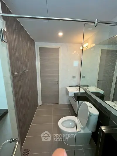 Modern bathroom with sleek design and glass shower enclosure