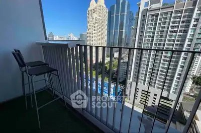 Stunning cityscape view from a modern high-rise balcony with sleek railing and seating.
