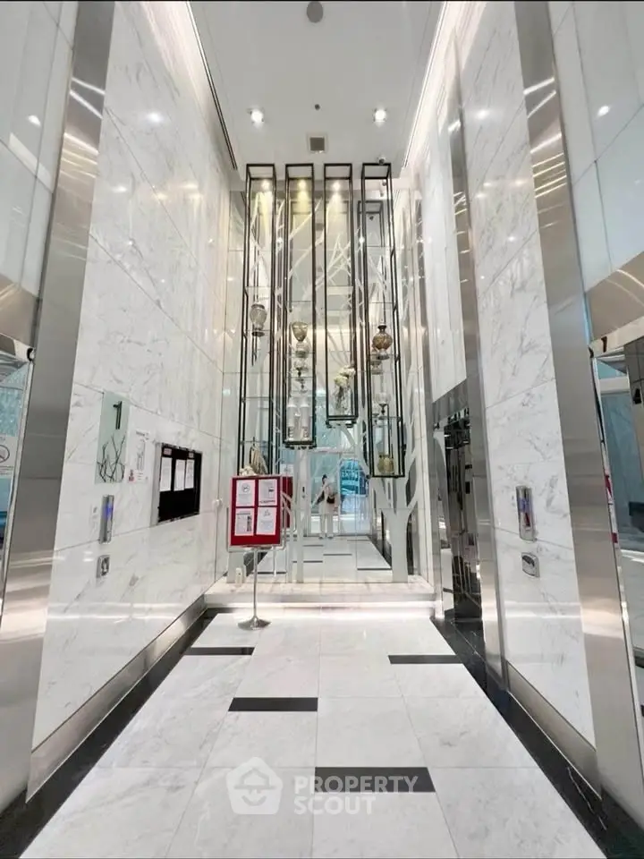 Luxurious marble elevator lobby with modern design and high ceilings
